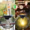 Solar Wrought Iron Lantern Light: Retro Mesh Pendant for Outdoor Garden, Courtyard, and Balcony Ambiance.