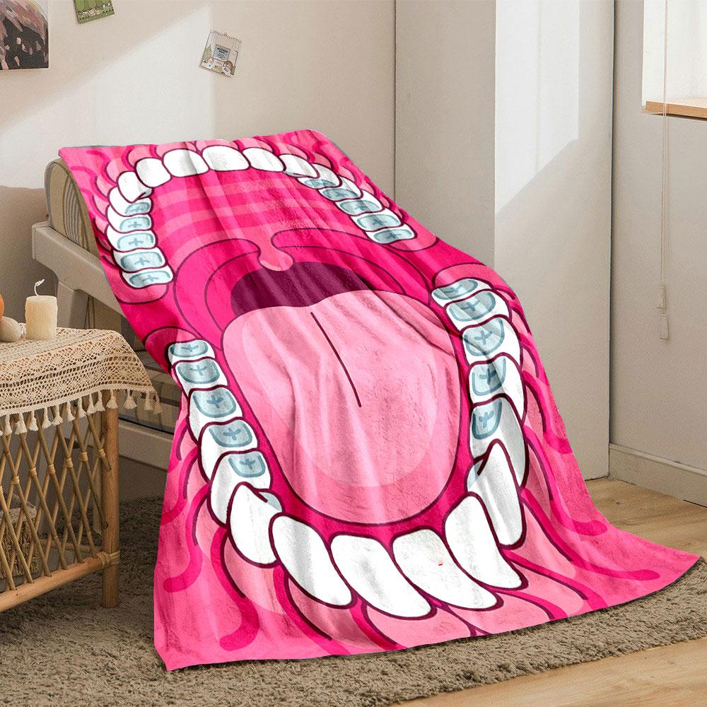 The pattern shows a stylized open mouth with teeth, braces, and a tongue. for all seasons blanket lunch break throw gift