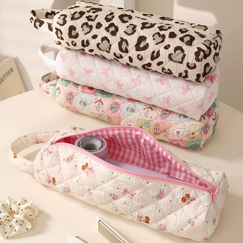 Bow-design hair tool storage bag with zipper. Dustproof for hair dryers and styling tools, ideal for travel and daily use.