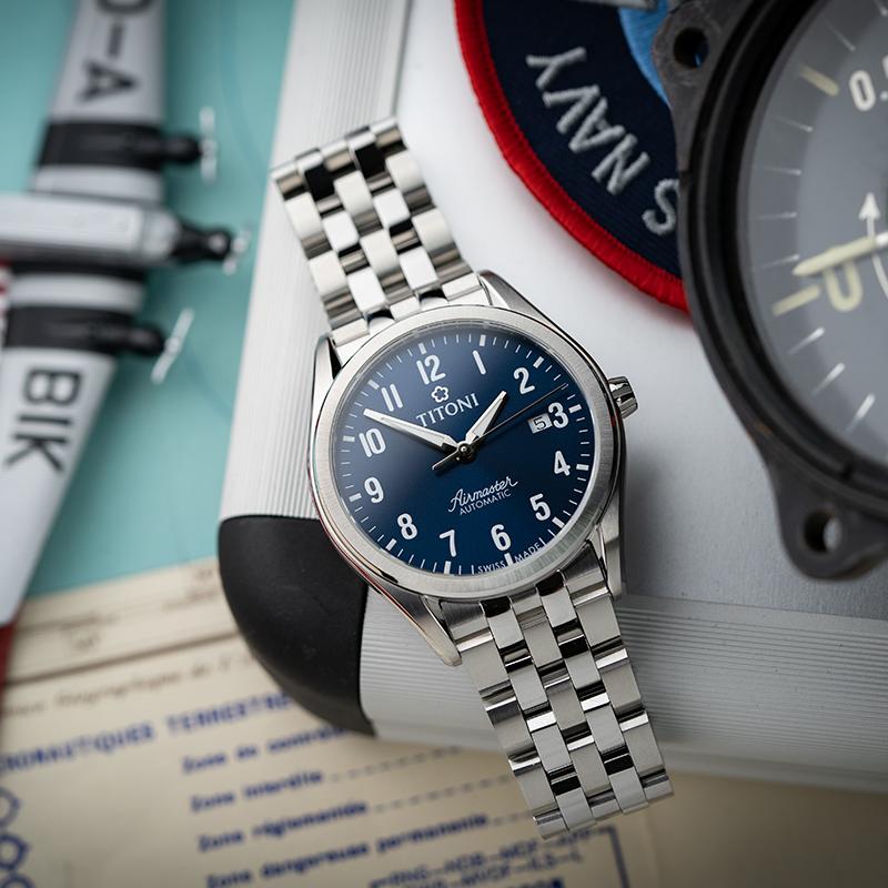 Titoni Цветок сливы Серия Airmaster Автоматический механический механизм Модный повседневный Синий циферблат Корпус из нержавеющей стали Ремешок из нержавеющей стали 83906 S-701