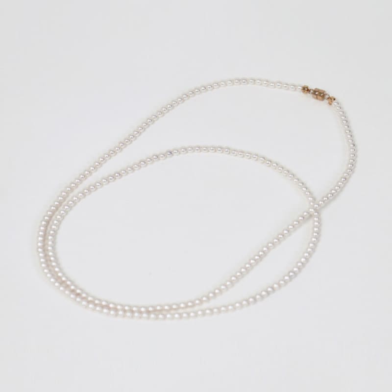 Less is more long pearl necklace