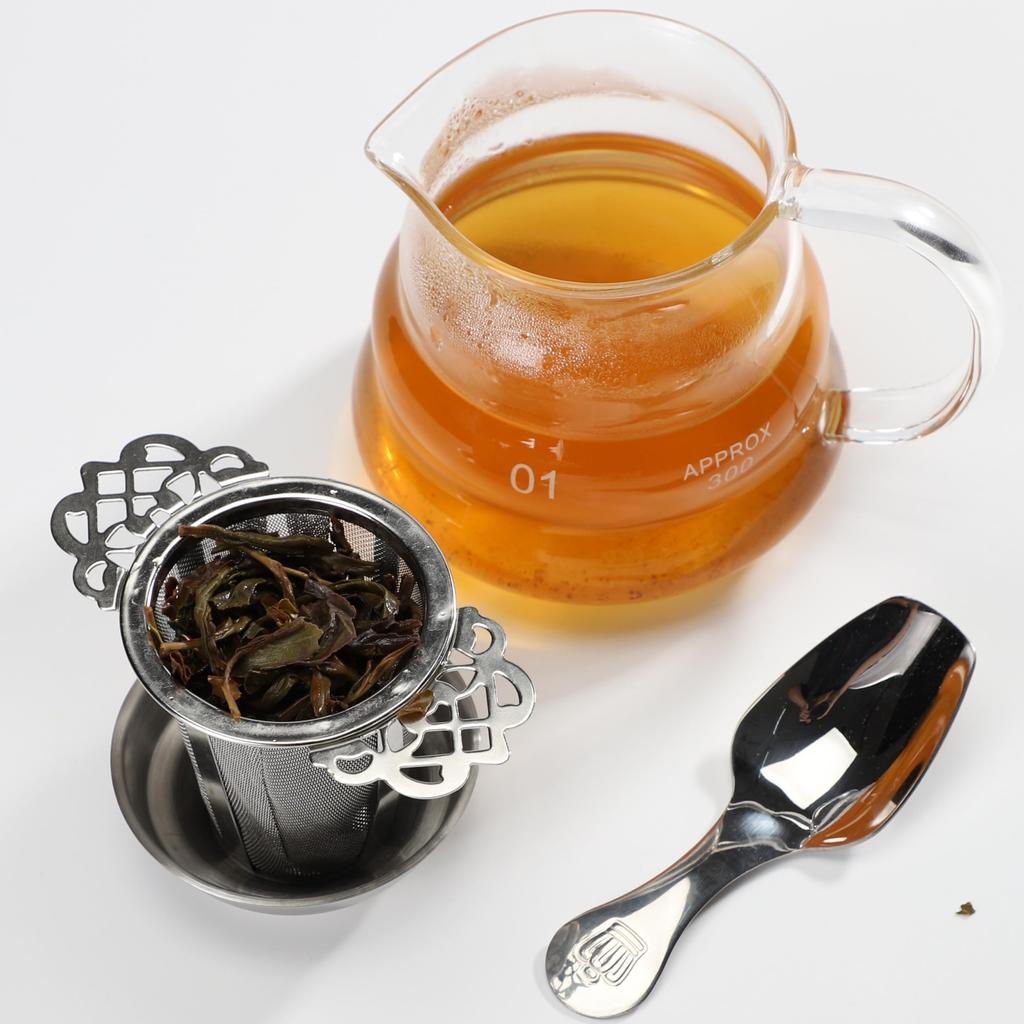 Stainless steel tea strainer with lid and teaspoon