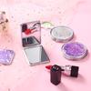 Girlish Heart Double-Sided Portable Makeup Mirror - Cute, Compact, and Foldable.