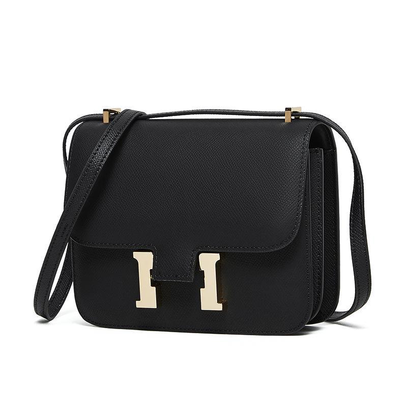 "2024 Кожаная сумка через плечо Kangkang с пряжкой H-образной формы: Модная, натуральная коровья кожа, универсальный дизайн на одно плечо.