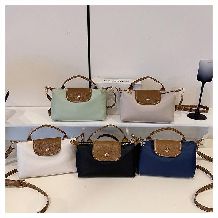 2026 summer mini dumpling bag fashionable versatile mini hand carry women's bag single shoulder messenger bag change mobile phone bag