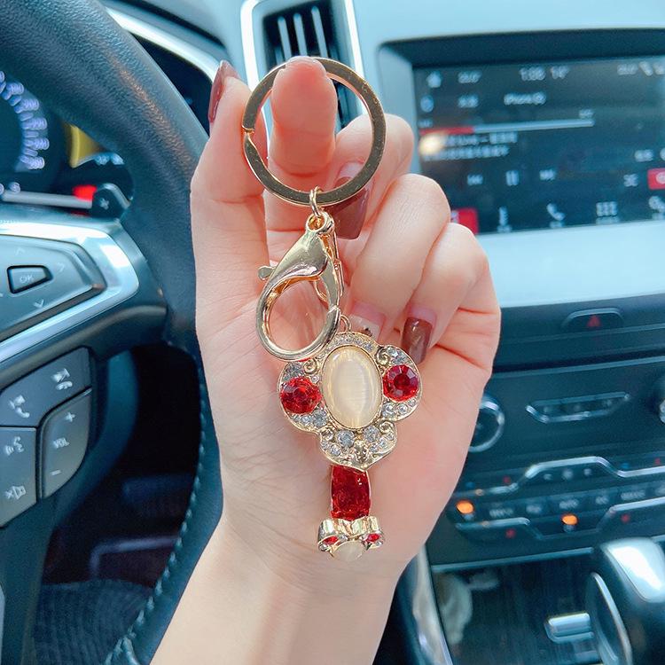 "2023 Red Series God of Wealth Keychain: Creative Money Bag for Car Keys, Annual Meeting Gift with Custom Logo Engraving"
