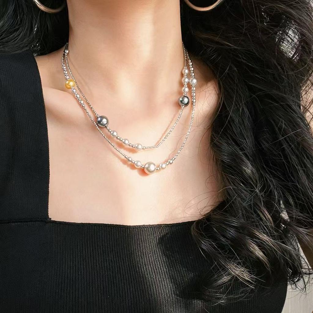 Vintage, high-quality, designer clavicle chain necklace featuring artificial crystal and pearl accents