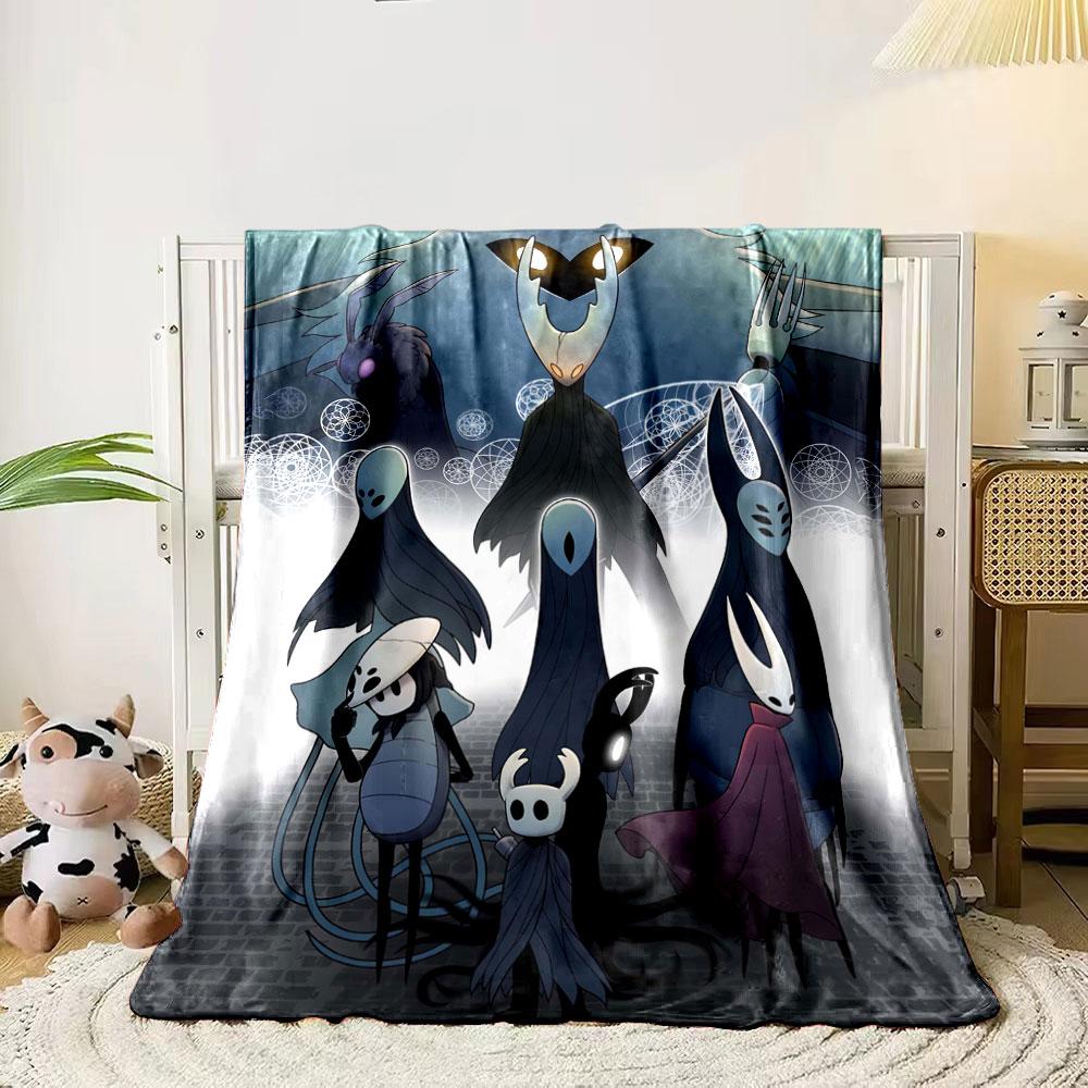 The pattern depicts dark, stylized insect-like characters in a mystical scene. for all seasons blanket lunch break throw gift