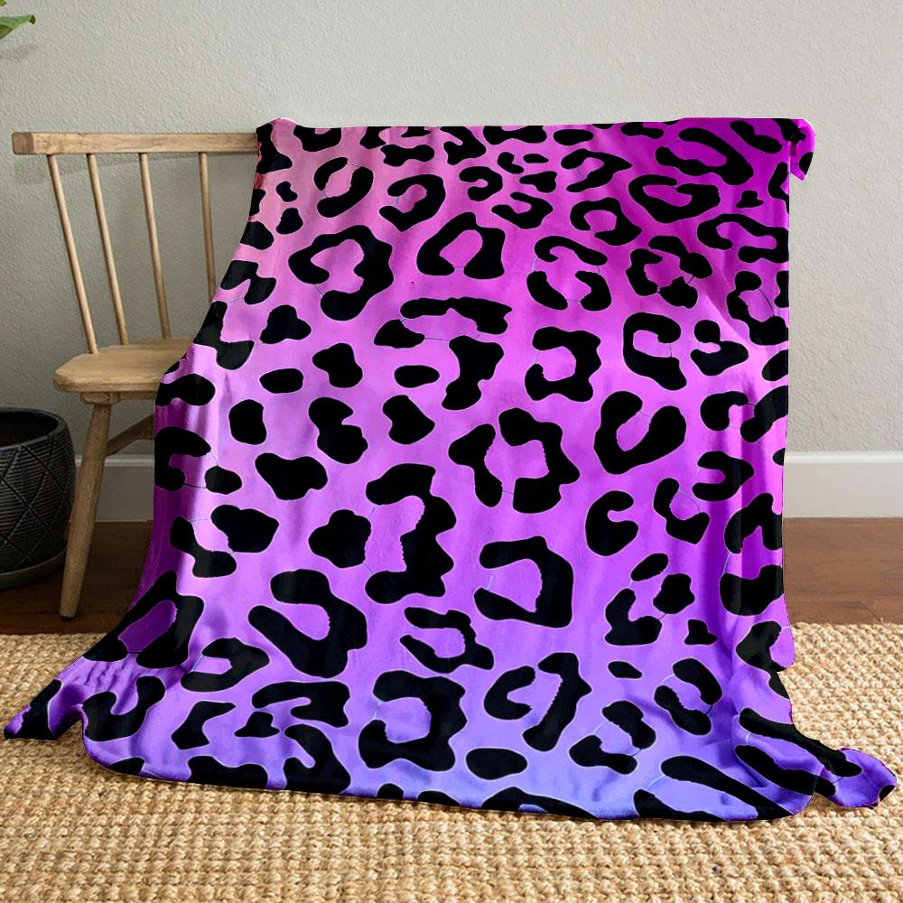 Leopard print pattern on a pink and purple gradient background. for all seasons blanket lunch break throw gift
