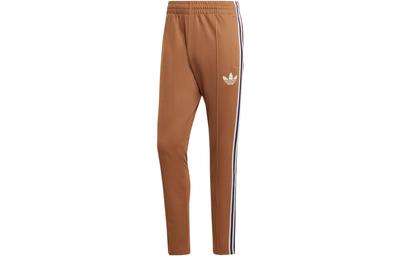 Спортивные брюки Adidas Adicolor 70-х в полоску, коричневые IB3430