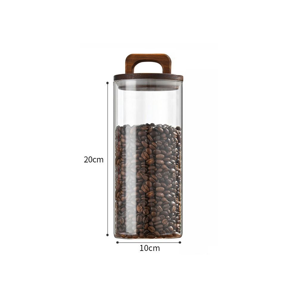 Прозрачные стеклянные банки с деревянной ручкой и крышкой. Банка для хранения. Простые герметичные бутылки. Кухня.