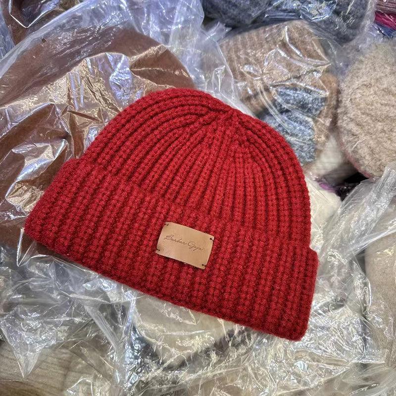 New simple leather label English alphabet wool hat women's autumn and winter outdoor warm wool hat cold hat men