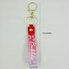 PVC Keychain with Leather Cord and Candy Soft Rubber Doll, Transparent Lanyard, and Jelly Gradient Color Hand Rope