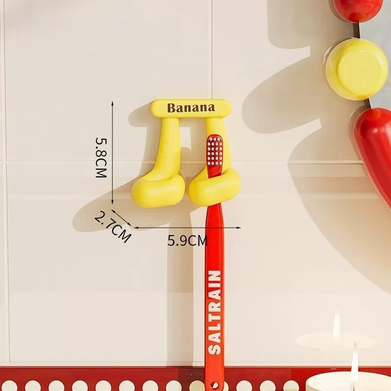 1PC Fruit-themed toothbrush holder for home bathrooms: wall-mounted, adhesive organizer rack for electric toothbrushes and dental care items.