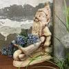 Garden figure dwarf with a wheelbarrow hand-made of concrete