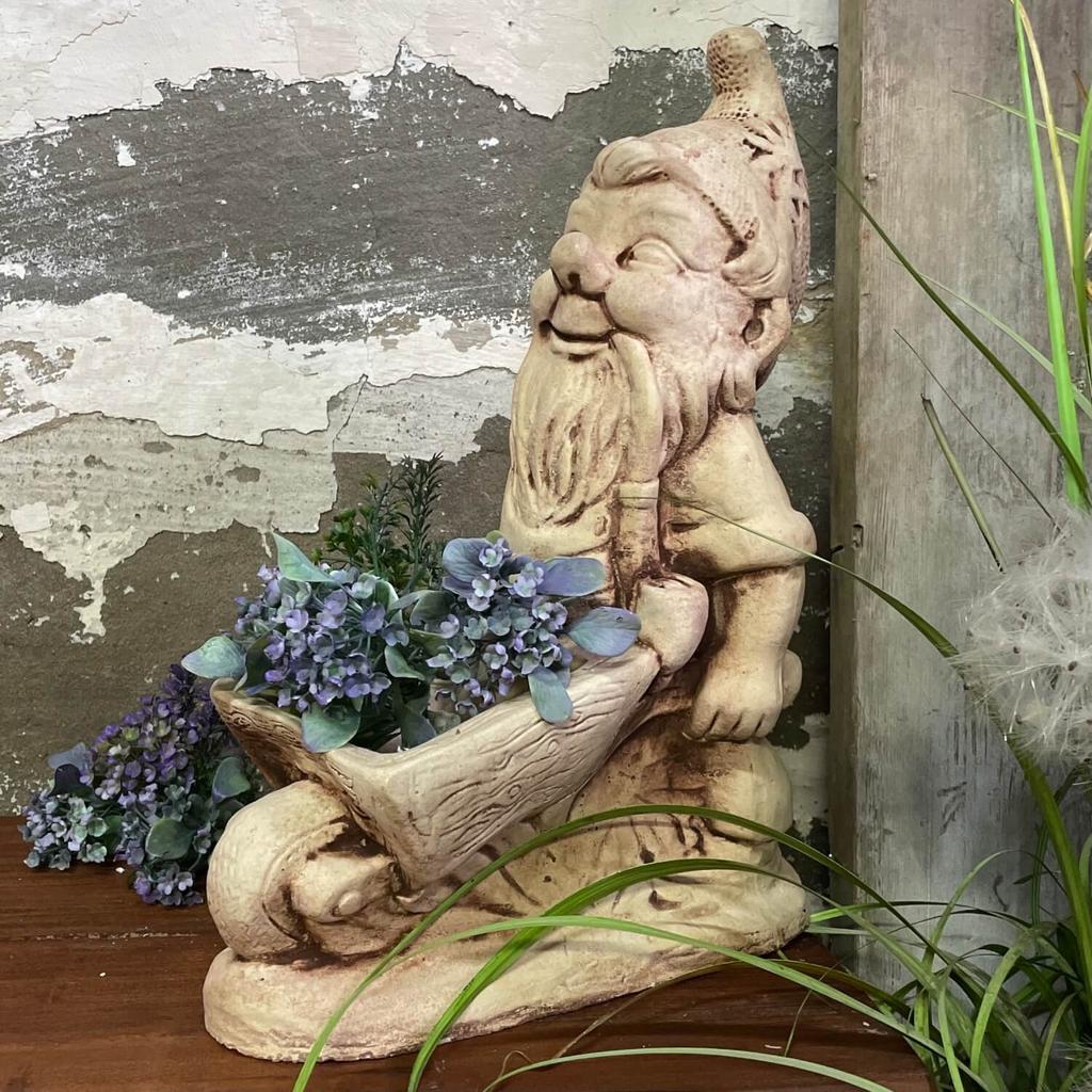 Garden figure dwarf with a wheelbarrow hand-made of concrete