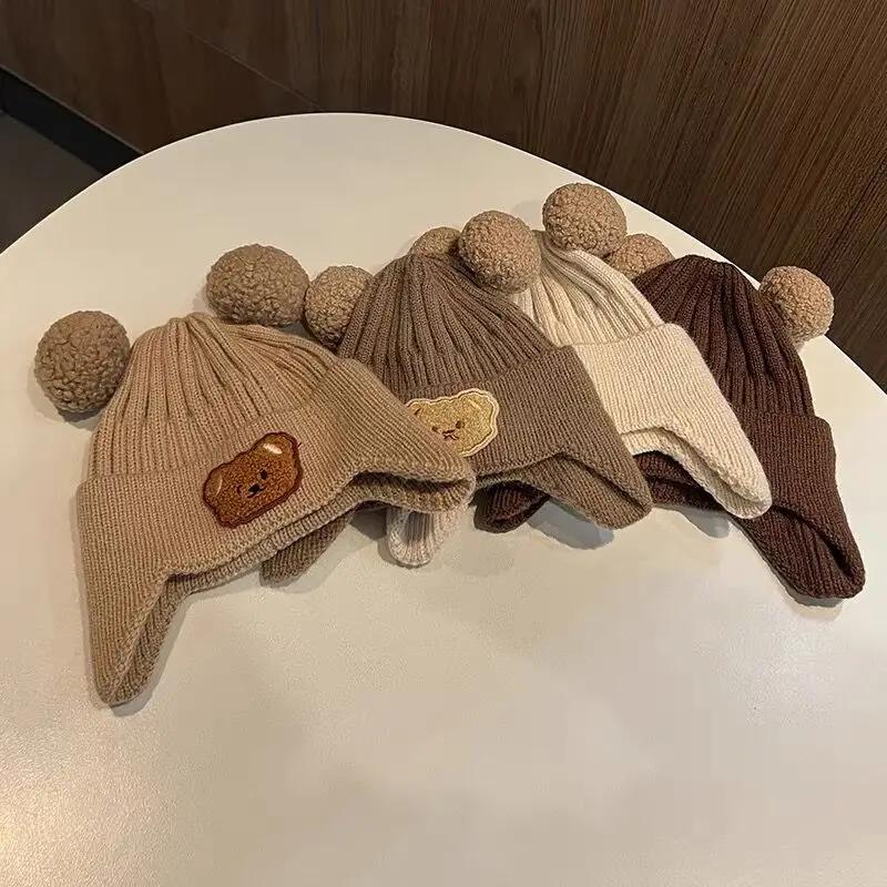Детские шапки-бини с мультяшным медведем, милые наушники для защиты ушей, вязаная шапка-чепчик для девочек, корейские зимние теплые детские вязаные шапки крючком