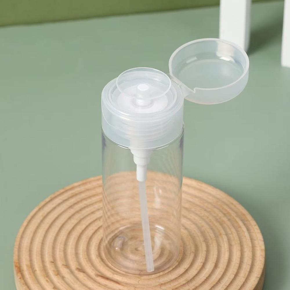 2 clear pump bottle dispensers press-down reusable travel bottle set for makeup, nail polish cleaning, cosmetics storage.