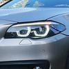 LED Daytime Running Lights & Ozum Laser Bi-Xenon Lens Headlight Assembly for 2011-2017 BMW 5 Series.