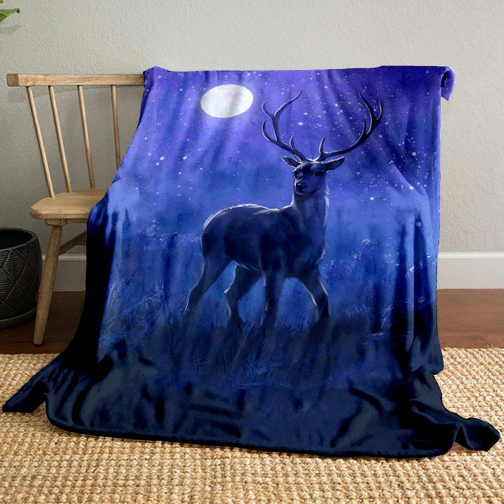 A stag stands in a moonlit, snowy, and serene nighttime setting. for all seasons blanket lunch break throw gift