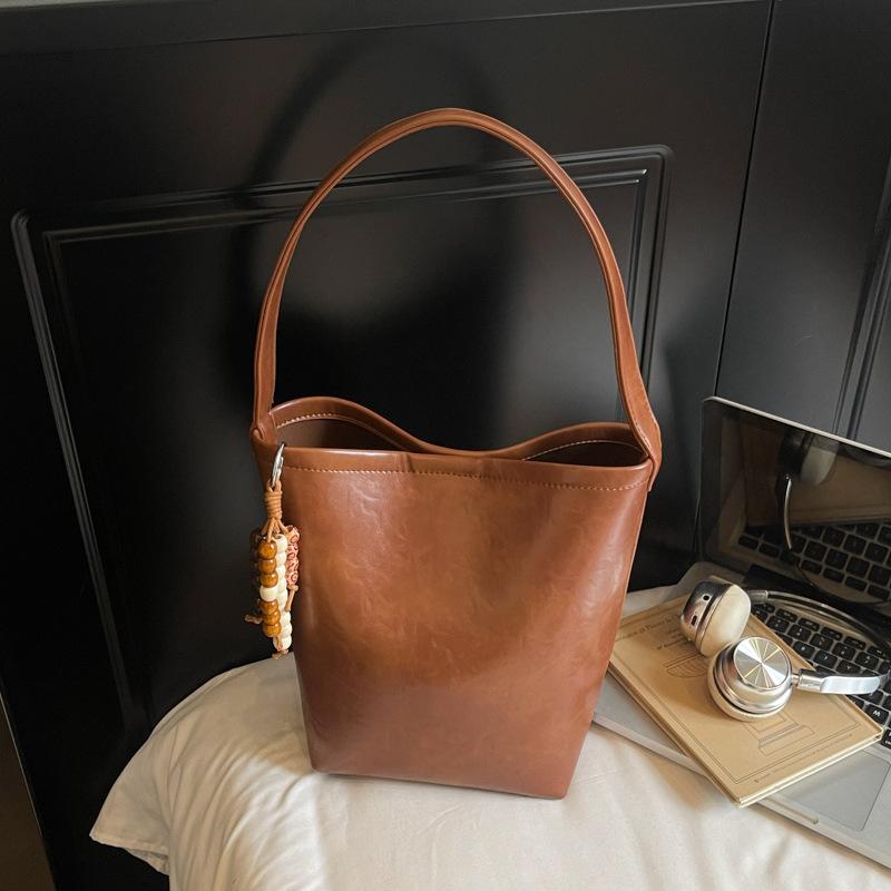 Сумка премиум-класса, нишевая, женская, осень-зима 2025, новая, ретро, универсальная, на плечо, сумка-мессенджер, повседневная и взрывная сумка-ведро