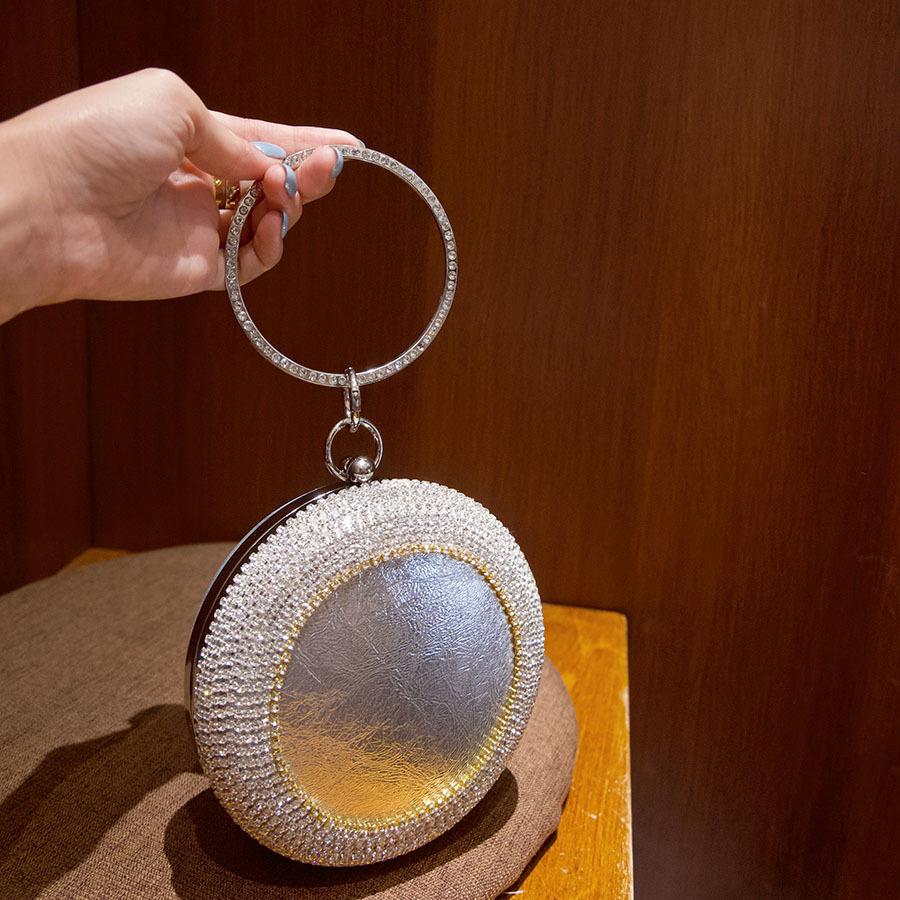 Luxury clutch bag, shiny rhinestone ring handbag, exquisite diamond-encrusted fashionable round bag.