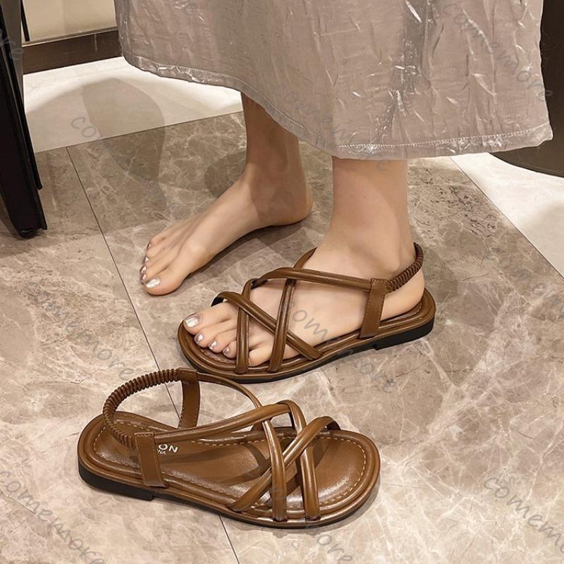 Мода Comemore 2025 Лето Новые Плоские Сандалии Женские Перекрестный Ремешок Открытый Носок Эластичная Женская Обувь Повседневные Однотонные Пляжные Мягкая Подошва Сандалии
