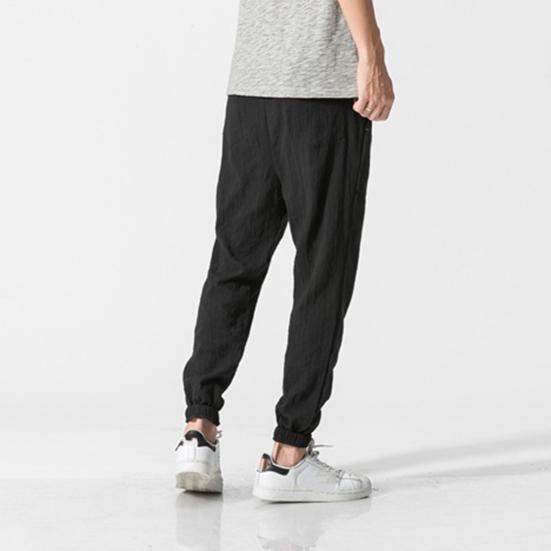 Весна Осень Мужские шаровары Шаровары Свободные завязывающиеся на шнурок эластичные карманы Глубокий шаговый шов с резинкой на щиколотке Однотонные спортивные брюки Повседневная одежда Спортивные брюки