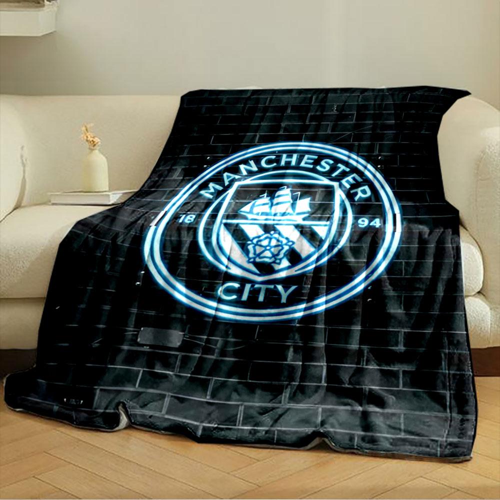 A glowing neon emblem with a ship, rose, and "Manchester City" text. for all seasons blanket lunch break throw gift