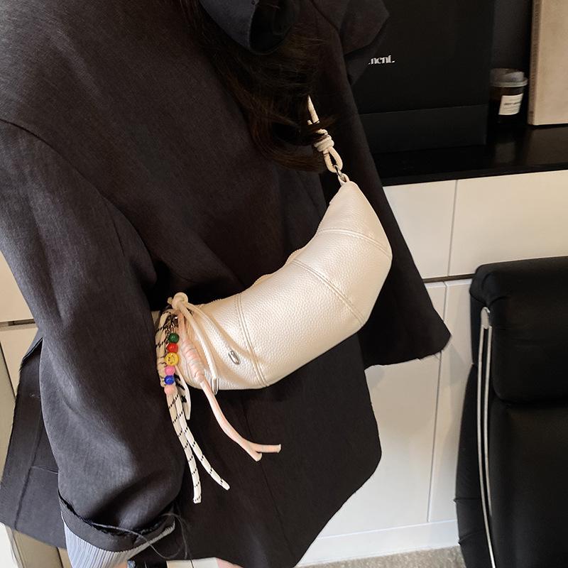 Французская нишевая сумка женская 2025 новая высококлассная на плечо сумка-мессенджер популярная весенне-летняя универсальная сумка-пельмень круассан