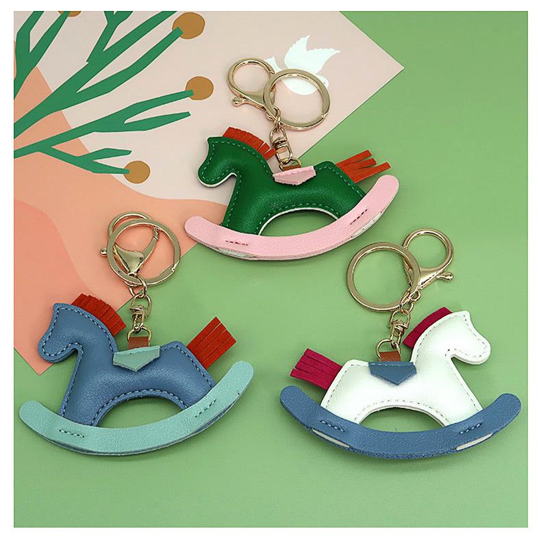Cartoon Rocking Horse Keychain: Creative PU Leather Pony Charm with Cotton Filling.