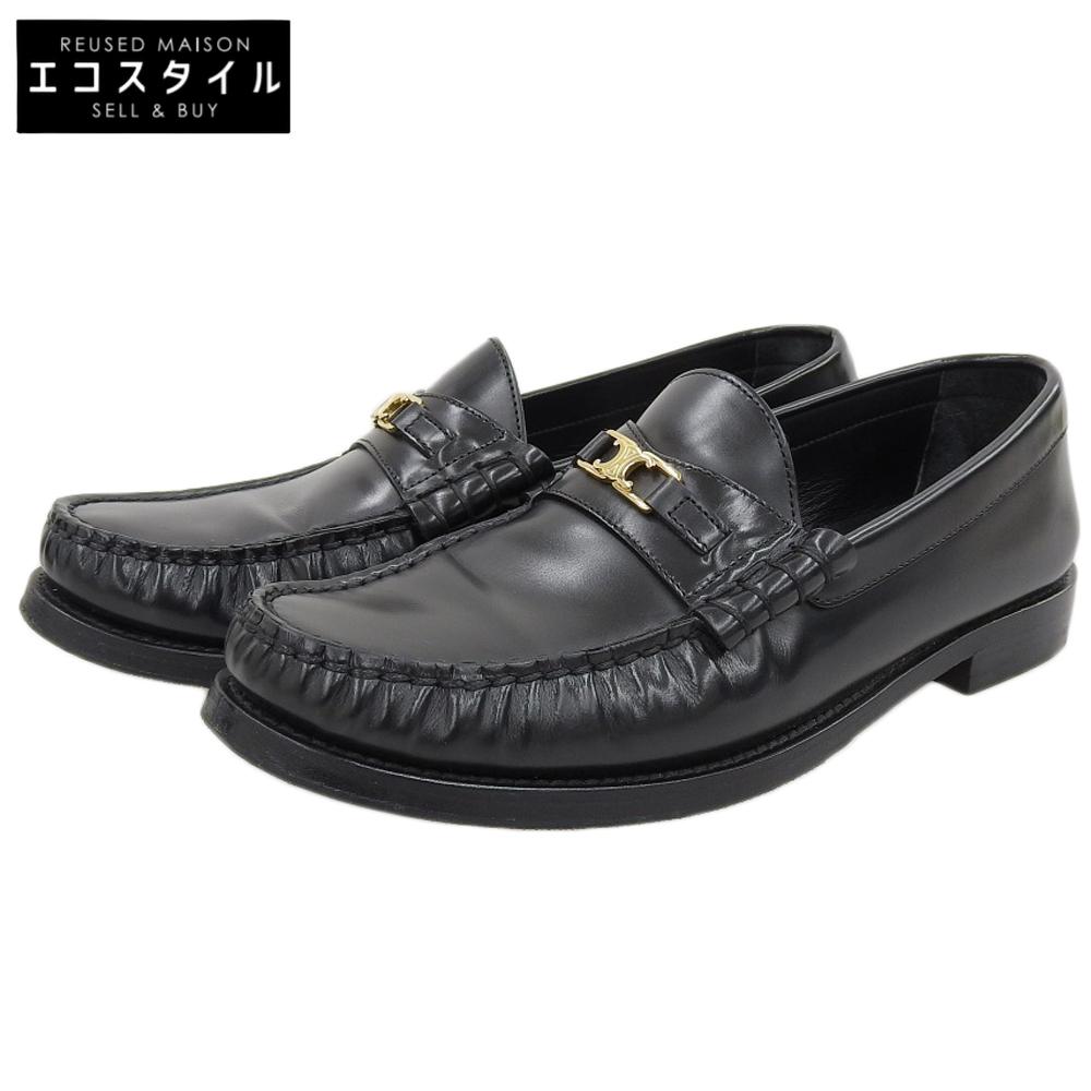 Celine Excellent Condition LUCO/Luco Polished Bullskin Triomphe Metal Piece Flat Loafers In Black and Gold, 335813602C Shoes 38.5 Black / goldUsed