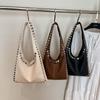 Niche design rivet tote bag women's new fashion high sense commuting fashion versatile shoulder armpit bag
