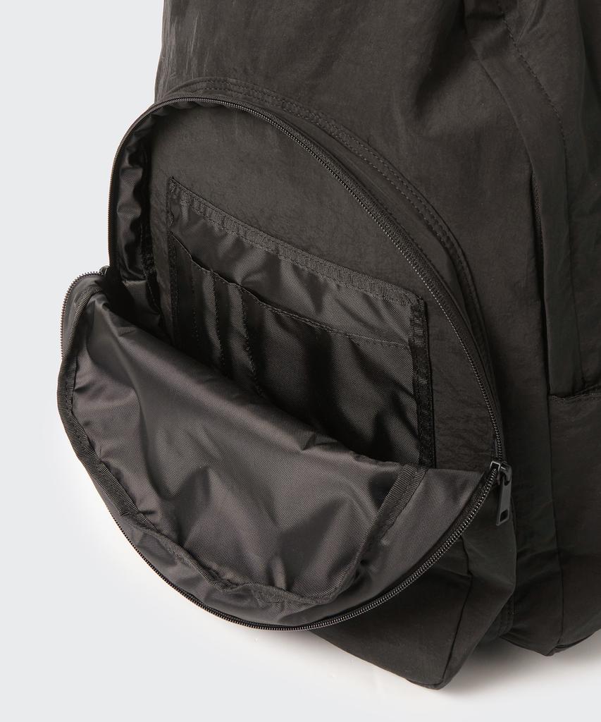 Musinsa Standard Crinkle Round Pocket Backpack [Dark Brown]