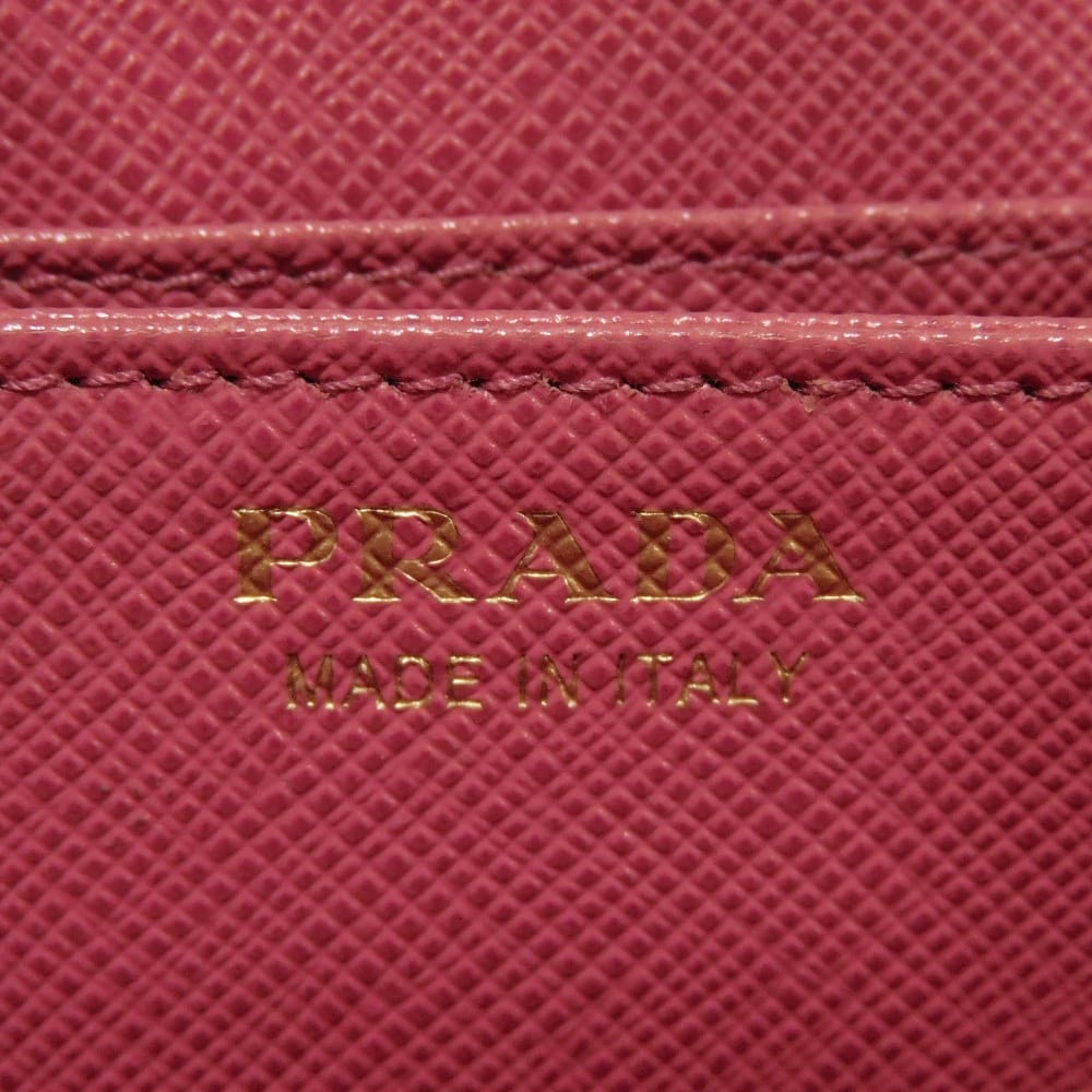 Подержанный 11569 Кошелек для монет Saffiano 1MM268 QHH F0505 7943 Розовый Картхолдер на молнии с треугольным логотипом Peonia Женский от