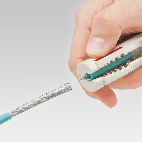 Tool for stripping insulation from telecommunications cables