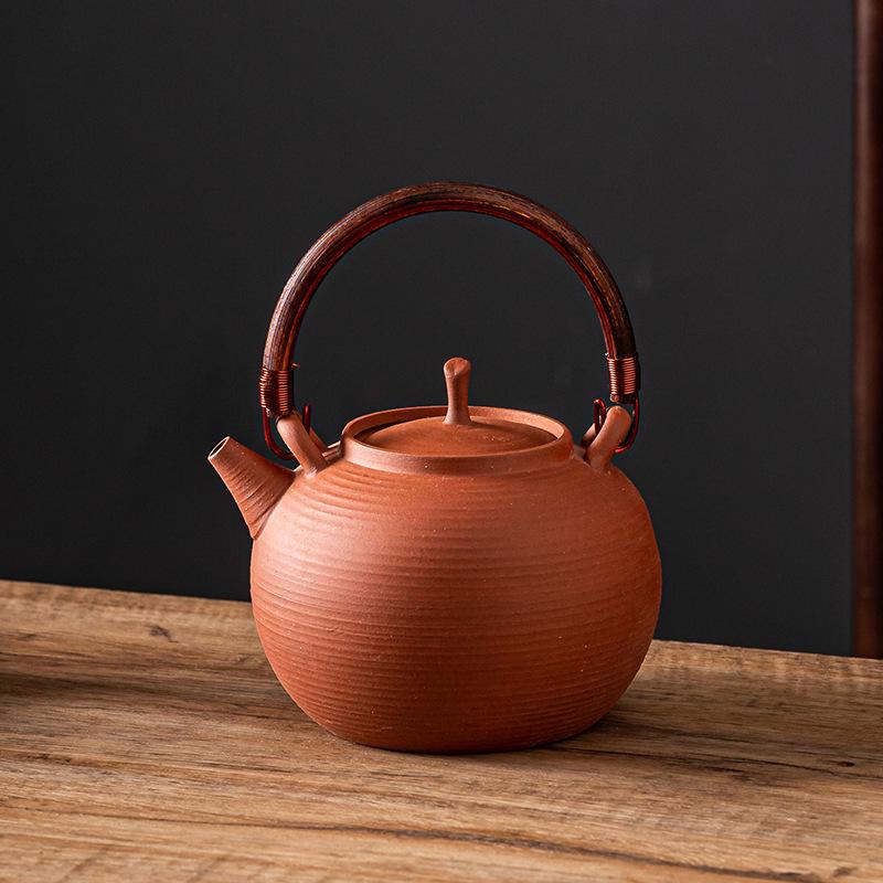 Керамический чайный сервиз «Кунг-фу»: Черный чайник с боковой ручкой и угольной горелкой для открытого огня.