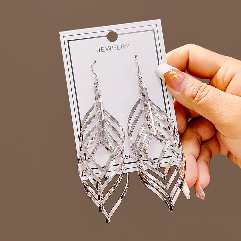 European & American Geometric Tassel Earrings - Long Leaf-Shaped Spiral Metal Design, Hollow & Exaggerated Style for Women