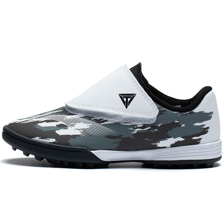 Подкладка Синтетическая кожа Удобные профессиональные устойчивые низкие детские футбольные бутсы Детские футбольные бутсы Черные белые ASTT008-4