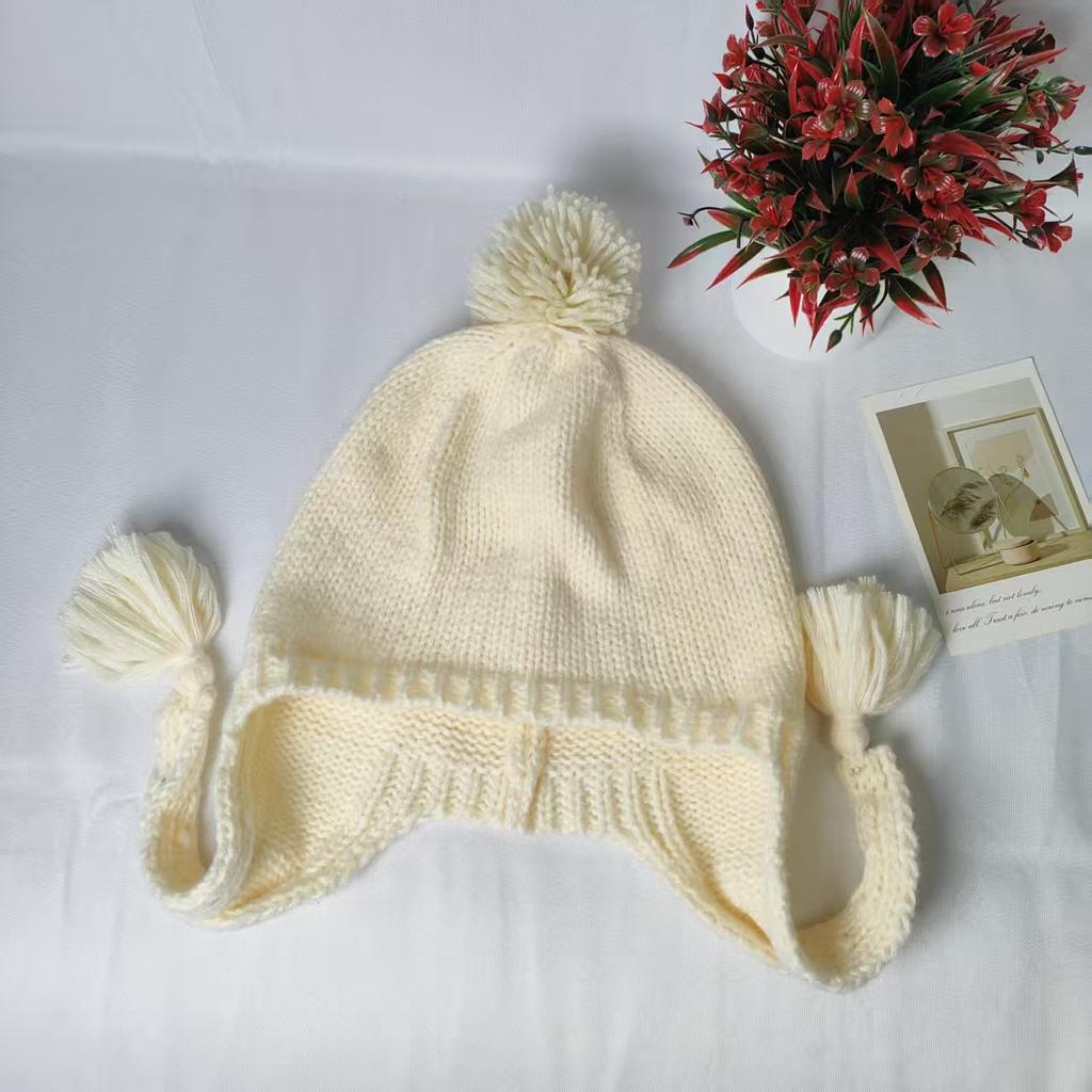 Solid color casual versatile braided hat autumn and winter cute knitted hairball hat warm and cold ear protection wool hat women