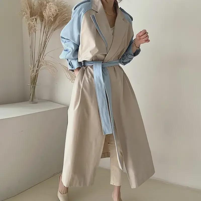 Women's Korean Chic Retro Trench Coat with French Lapel, Color-Contrast Stitching, and Lace Waist Trim.