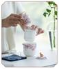 White Porcelain Floral Travel Tea Set: Includes One Pot, Three Cups, and Portable Bag.