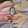 Elegant Women's Oval Mother-of-Pearl Dial Chain Watch with Fragrance Design