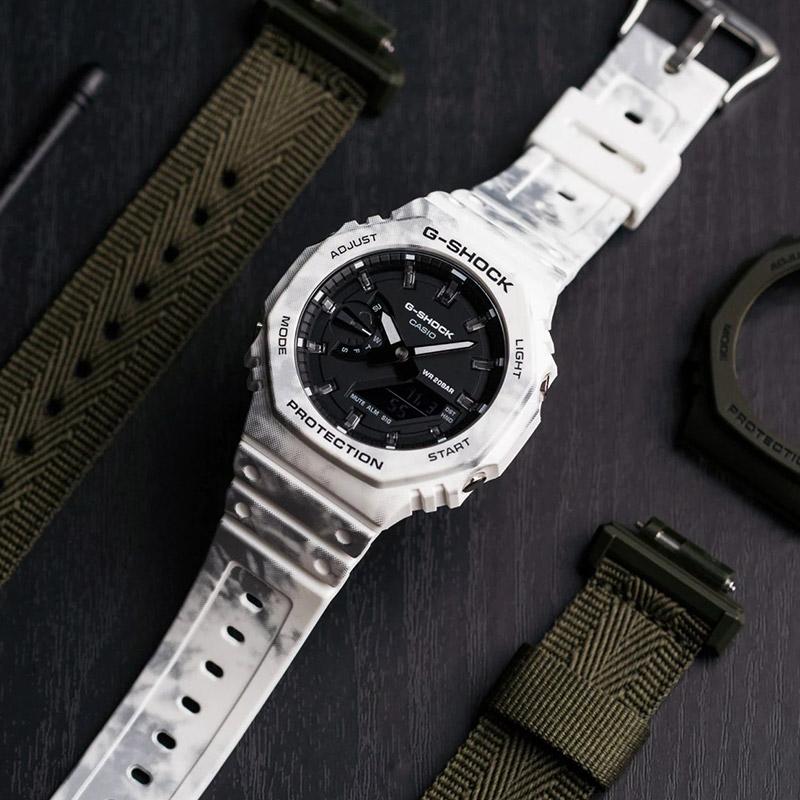 Casio Серия «Снежный камуфляж» Сменный ремешок Водонепроницаемые и ударопрочные Спортивные часы Кварцевый механизм Пластиковый ремешок Японские и GAE-2100GC-7APR