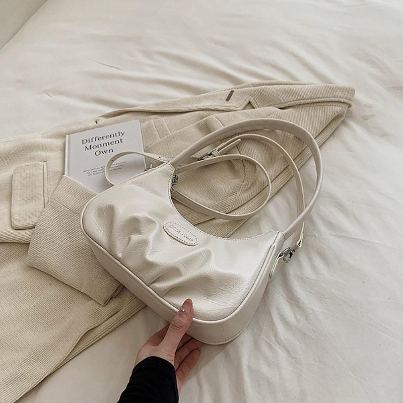 Корейская версия подмышечная сумка складная искусственная кожа однотонная женская сумка нишевый дизайн чувственная текстура одно плечо сумка простая новая