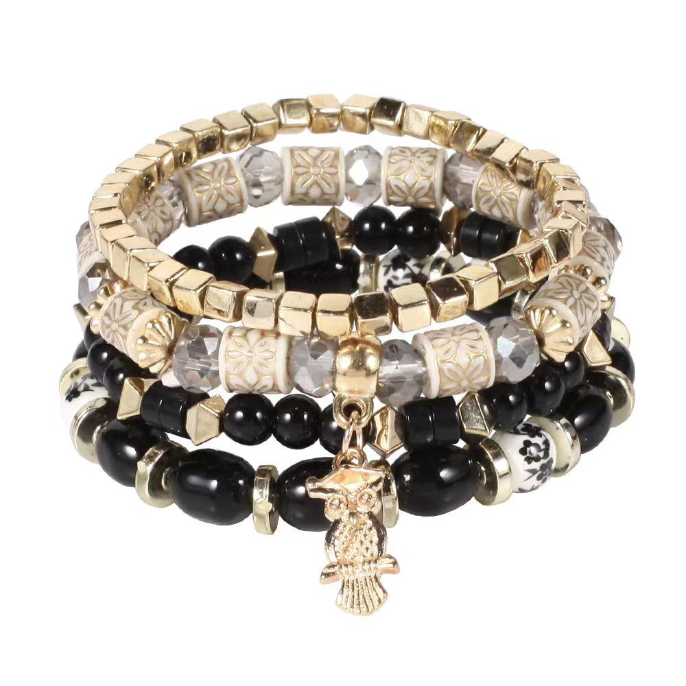 Богемный многослойный браслет с бусинами и подвеской-совой