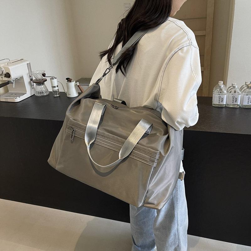 Простая повседневная дорожная сумка большой вместимости для мужчин и женщин студентов во время школьных каникул. Сумка для багажа для рычага
