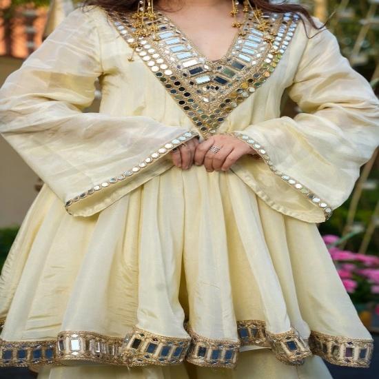 Elegant Off-White Silk Peplum Sharara Set with Heavy Gota & Mirror Work