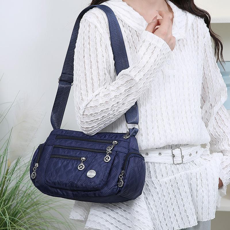 Outdoor Leisure Joker Messenger Bag Female Large Capacity Rhombic Embroidery Simple Shoulder Bag Three Layer Storage Middle Aged Handbag.