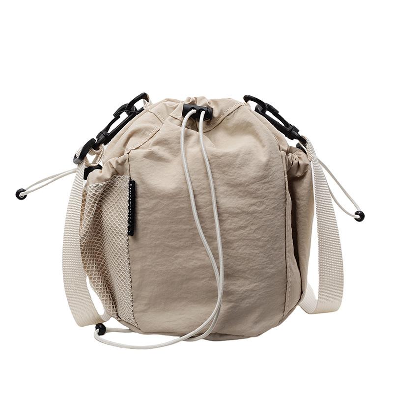 2025 New Japanese Leisure Niche Outdoor Sports Drawstring Bucket Bag Fashionable Versatile Light Travel Messenger Bag